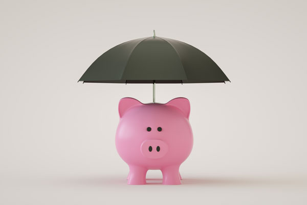 Piggy bank under umbrella of Group Benefits in McAllen.