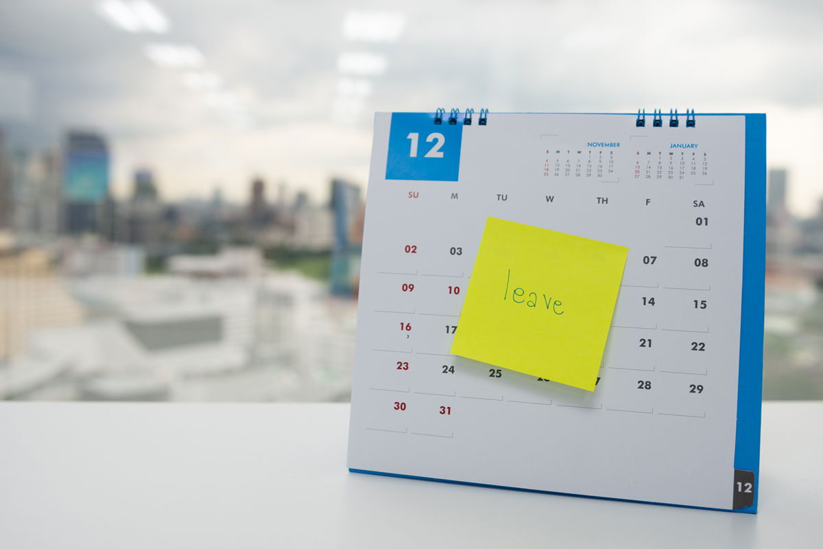 employee benefits calendar on desk