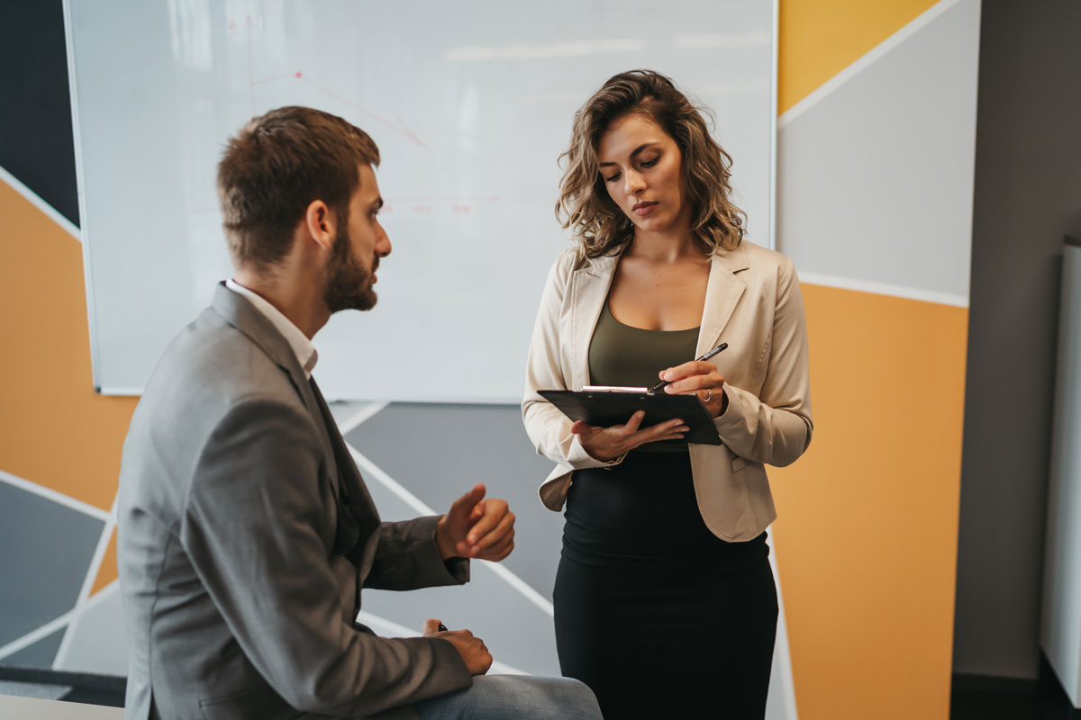 two people looking at employee benefits in McAllen from Shepard Walton Employee Benefits